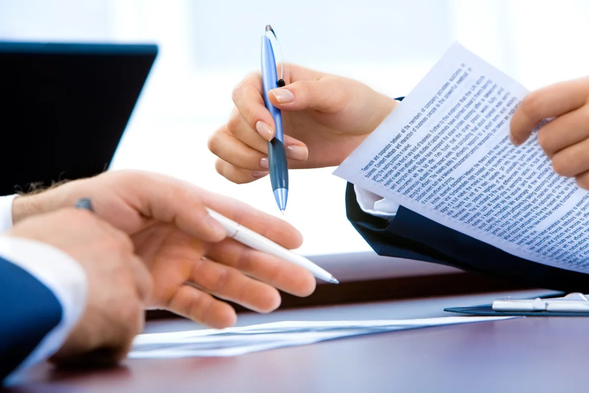 Food business owner reviewing documents at a desk