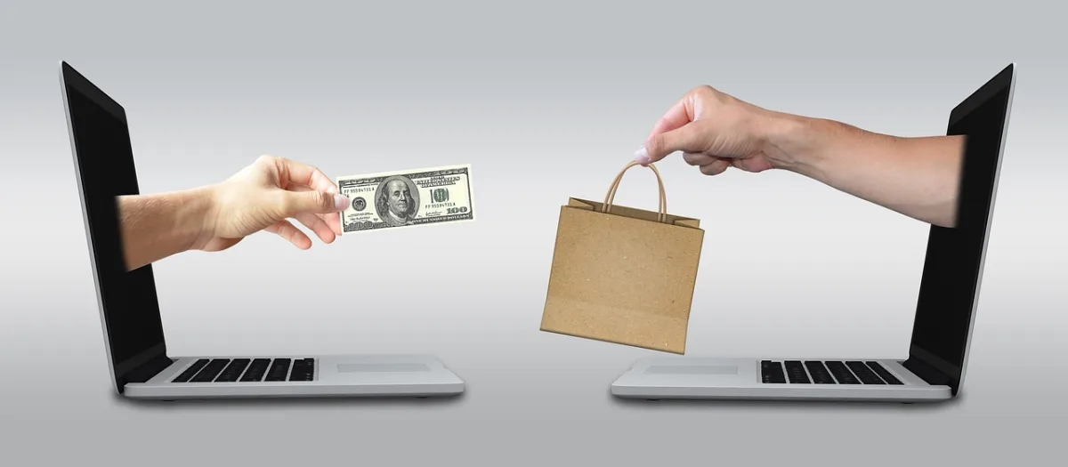 Factory owner using a laptop to pay property tax and licence fee online